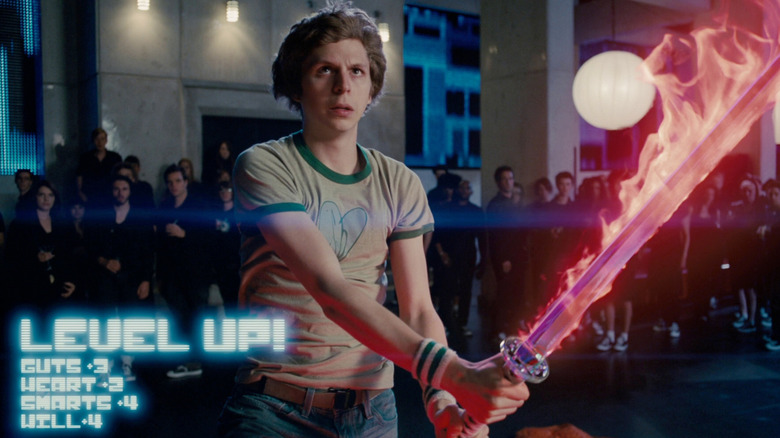 Michael Cera as Scott wields a flaming sword in Scott Pilgrim vs the World