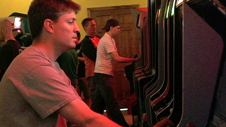 Steve Wiebe looks ahead while playing Donkey Kong in an arcade in The King of Kong: A Fistful for Quarters