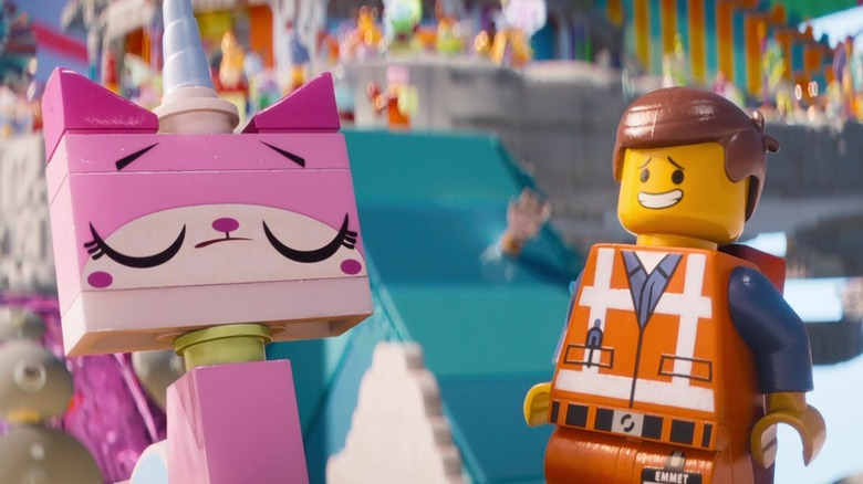 Unikitty closes her eyes while standing next to Emmet Brickowski who is looking toward her in The Lego Movie