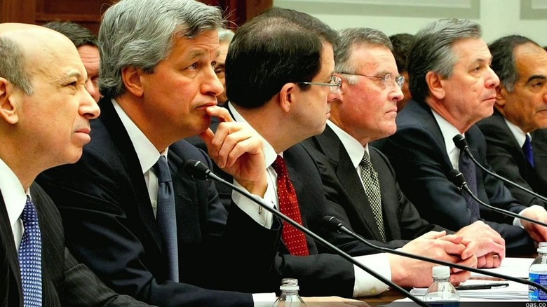 A group of investment banking executives testify in front of Congress in Inside Job (2010)