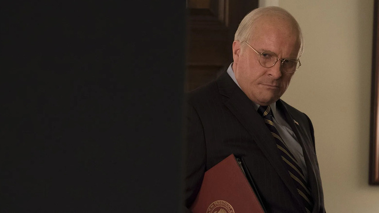 Vice President Dick Cheney holding a binder in Vice (2018)