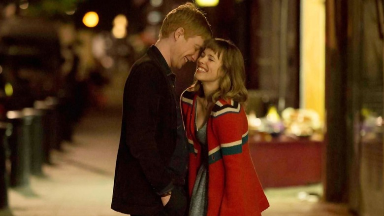 Domhnall Gleeson as Tim standing next to Rachel McAdams as Mary in About Time