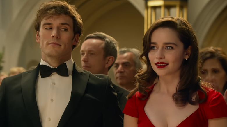 Emilia Clarke as Lou sits on the lap of Sam Claflin as Will in Me Before You