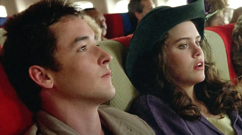 Ione Skye as Diane laughs in a car with John Cusack as Lloyd in Say Anything ...