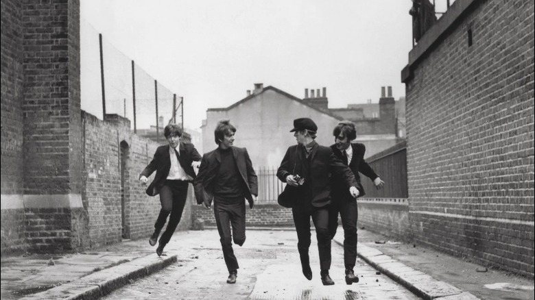 The Beatles running down street