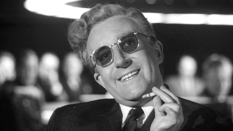 Dr. Strangelove smiling holding cigarette