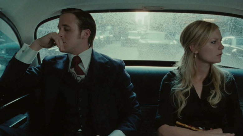 Ryan Gosling and Kirsten Dunst as David and Katie Marks, riding in the back of a car in All Good Things