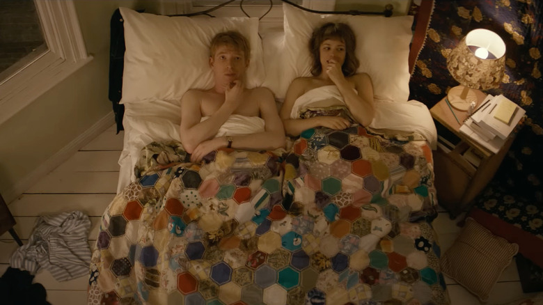 Domhnall Gleeson as Tim lies in bed next to Rachel McAdams as Mary in About Time