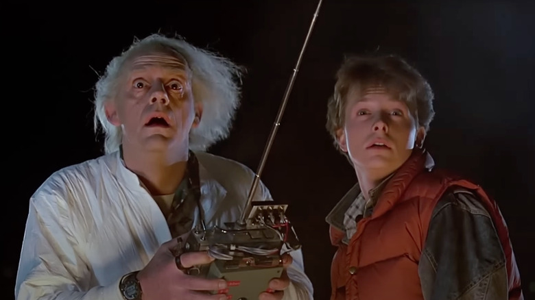 Christopher Lloyd as Doc Brown and Michael J. Fox as Marty McFly look shocked in Back to the Future