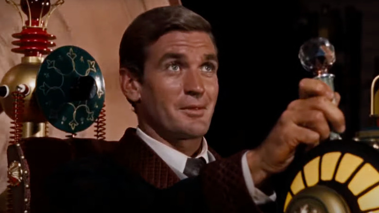 Rod Taylor as H. George Wells sits in his time travel device in The Time Machine