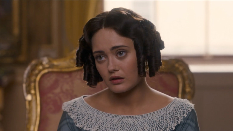 Maria Grey (Ella Purnell) glances up while sitting down in Belgravia