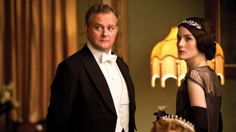 Robert Crawley (Hugh Bonneville) stands next to Mary Crawley (Michelle Dockery) on Downton Abbey