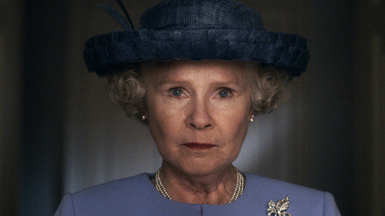 Elizabeth II (Imelda Staunton) stands ready in a hat on The Crown