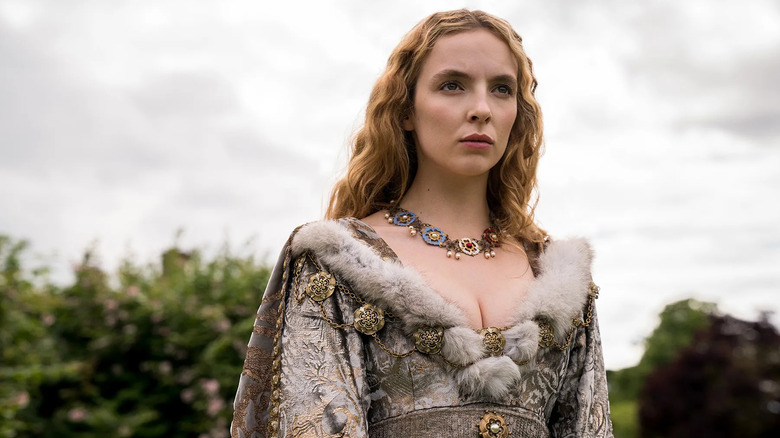 Elizabeth of York (Jodie Comer) stands contemplatively outside on The White Princess