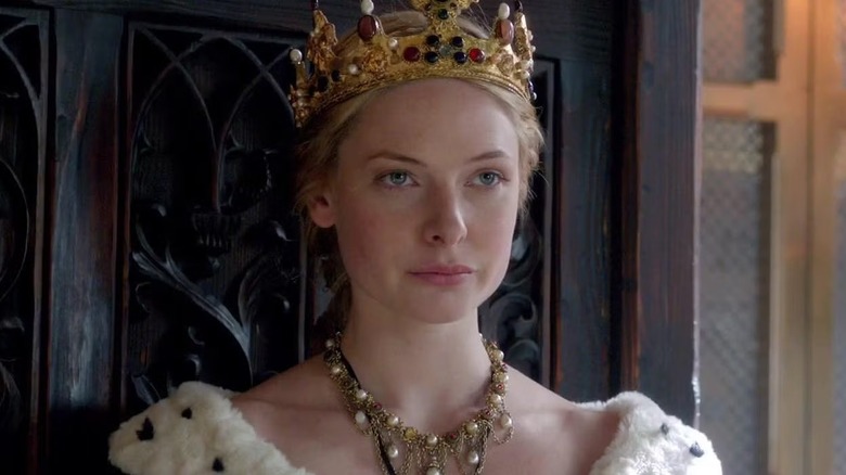 Elizabeth Woodville (Rebecca Ferguson) sits on a throne on The White Queen