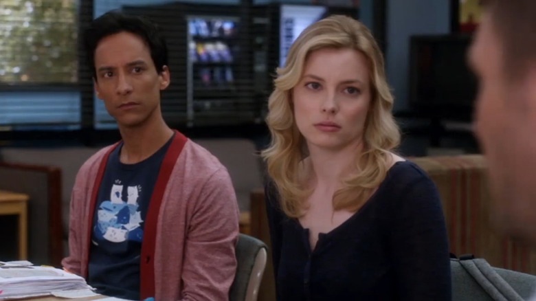 Abed (Danny Pudi) and Britta (Gillian Jacobs) looking at Jeff (Joel McHale) on Community