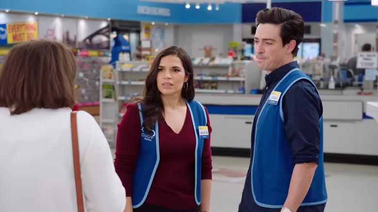 Jonah (Ben Feldman) and Amy (America Ferrera) talking to a customer on Superstore