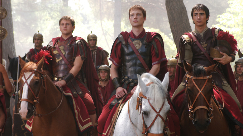 Augustus (Simon Woods) and his men on horseback in Rome