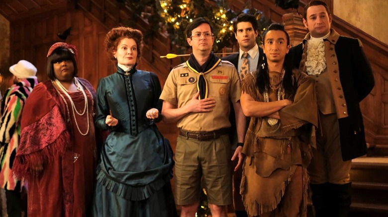 Danielle Pinnock as Alberta Haynes, Rebecca Wisocky as Hetty Woodstone, Richie Moriarty as Pete Martino, Asher Grodman as Trevor,  Román Zaragoza as Sasappis, and Brandon Scott Jones as Isaac Higgintoot stand together at the end of a staircase on the CBS version of Ghosts