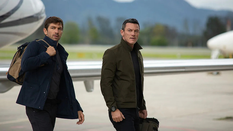 Prince (Michiel Huisman) and Bambi (Luke Evans) step off a plane on Echo 3