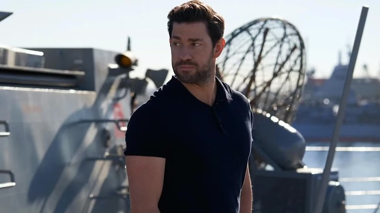 Jack Ryan (John Krasinski) stands by a battleship on Jack Ryan