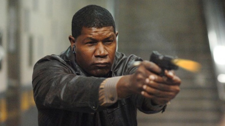 Blane (Dennis Haysbert) fires a pistol on The Unit