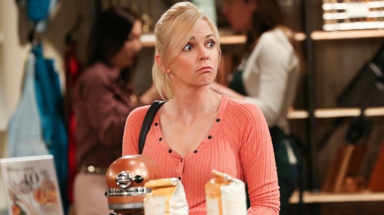 Christy (Anna Faris) looks shocked in a restaurant in Mom