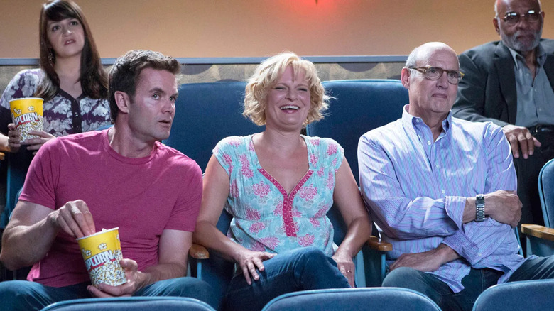 Burt (Garret Dillahunt) and Virginia (Martha Plimpton) sit in a movie theater in Raising Hope