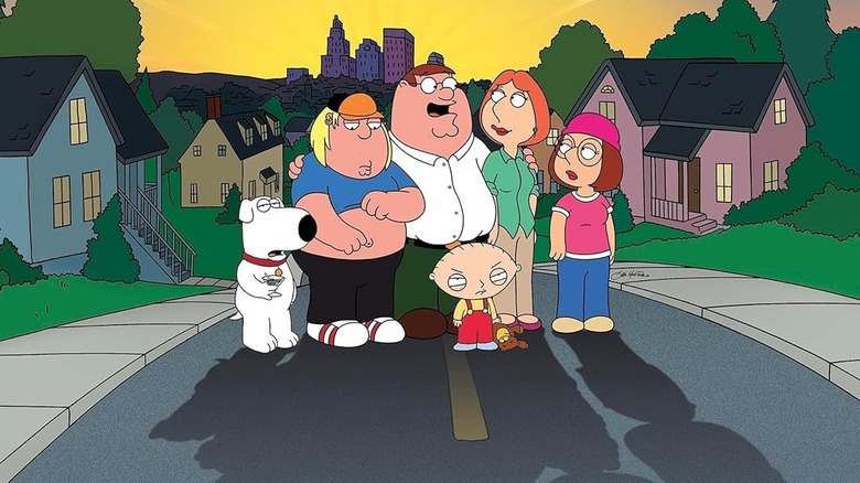 Peter Griffin (Seth MacFarlane) embraces his family in the middle of a street on Family Guy