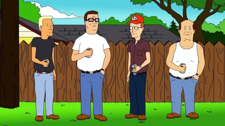 Hank Hill (Mike Judge) drinks beer with his friends by a wooden fence on King of the Hill