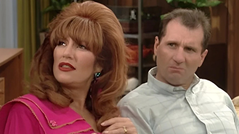 Peggy (Katey Sagal) and Al (Ed O'Neill) stare up incredulously on Married... with Children