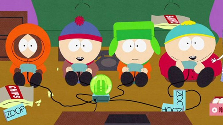 Kenny (Matt Stone), Stan (Trey Parker), Kyle (Stone), and Cartman (Parker) play video games on South Park