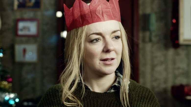 Sheridan Smith as Christine wearing a red paper crown in the Inside Number 9 episode The 12 Days of Christine