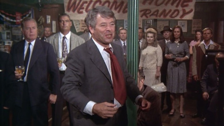 William Windom as Randy Lane, standing surrounded by his coworkers in a bar on Night Gallery