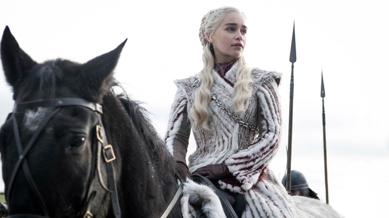 Emilia Clarke's Daenerys Targaryen riding a horse in Game of Thrones