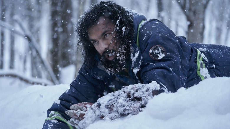 Himesh Patel as Jeevan Chaudhary lying in the snow in Station Eleven