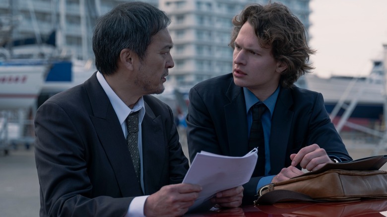 Ken Watanabe's Hiroto Katagiri speaking to Ansel Elgort's Jake Adelstein in Tokyo Vice