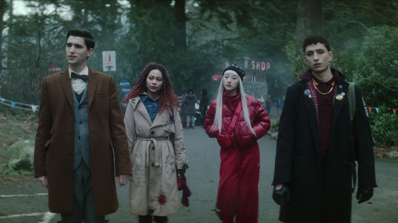 The Dead Boy Detectives standing in a street with their friends