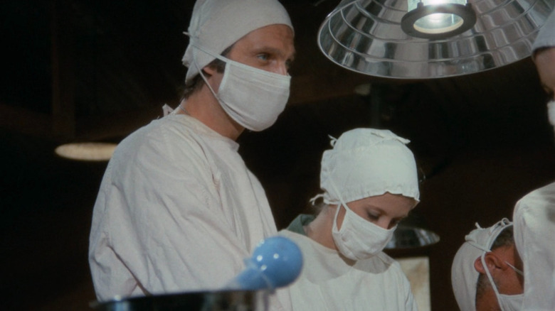 Hawkeye (Alan Alda) performing surgery on M*A*S*H