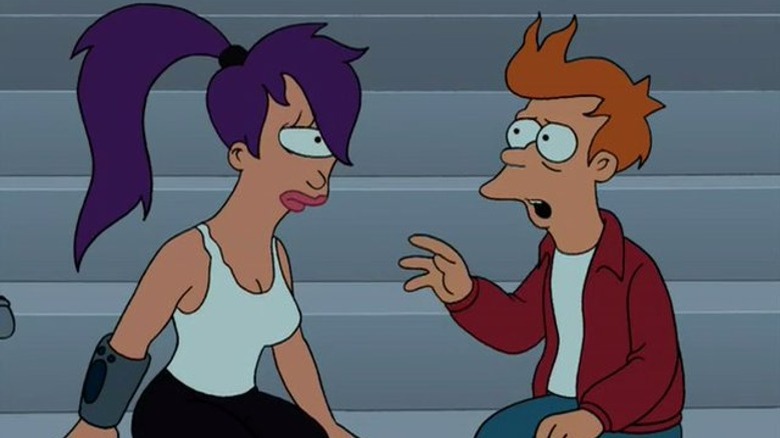 Fry raises his hand while talking to Leela