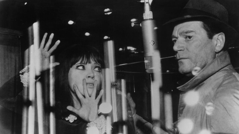 Anna Karina and Eddie Constantine trapped in Alphaville.