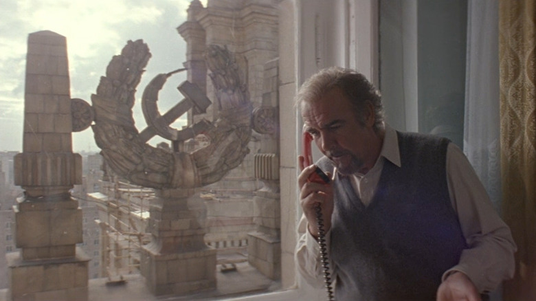 Sean Connery taking a call in a Russian hotel room.