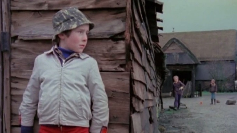 A small child in a military cap 