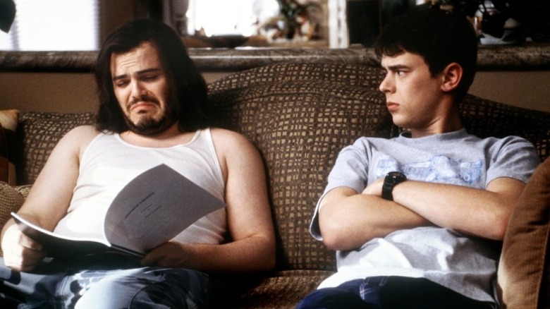 Jack Black and Colin Hanks sit on couch