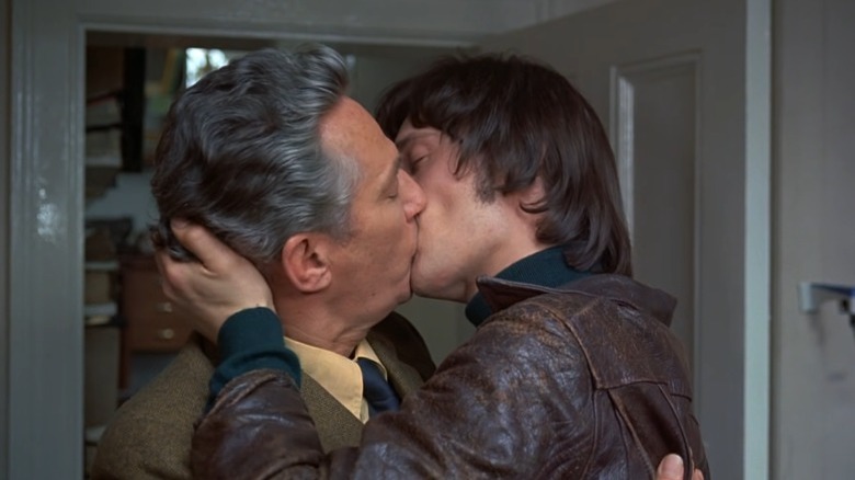 Daniel and Bob share a kiss