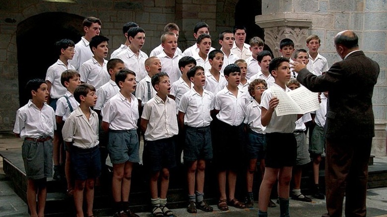 boys choir singing in courtyard