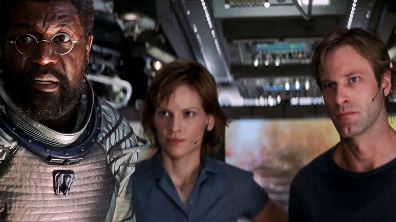 Delroy Lindo, Hilary Swank, and Aaron Eckhart in their ship in The Core