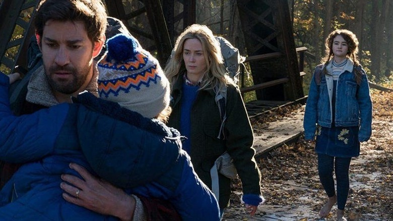 a quiet place Krasinski and Blunt protect their children