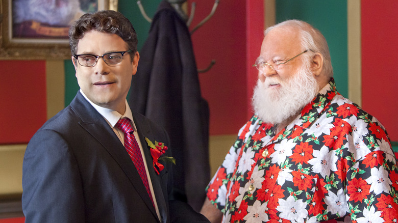 Sean Astin as Eddie with Santa in Hawaiian shirt in Santa Switch