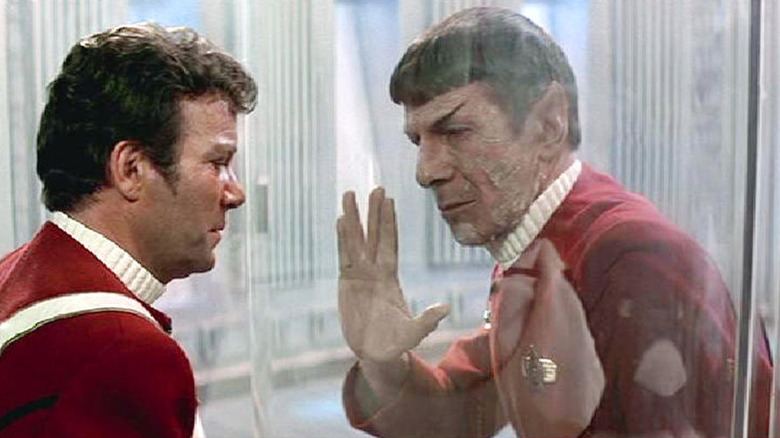 A dying Spock (Leonard Nimoy) gives Kirk (William Shatner) the Vulcan salute in Star Trek II: The Wrath of Khan